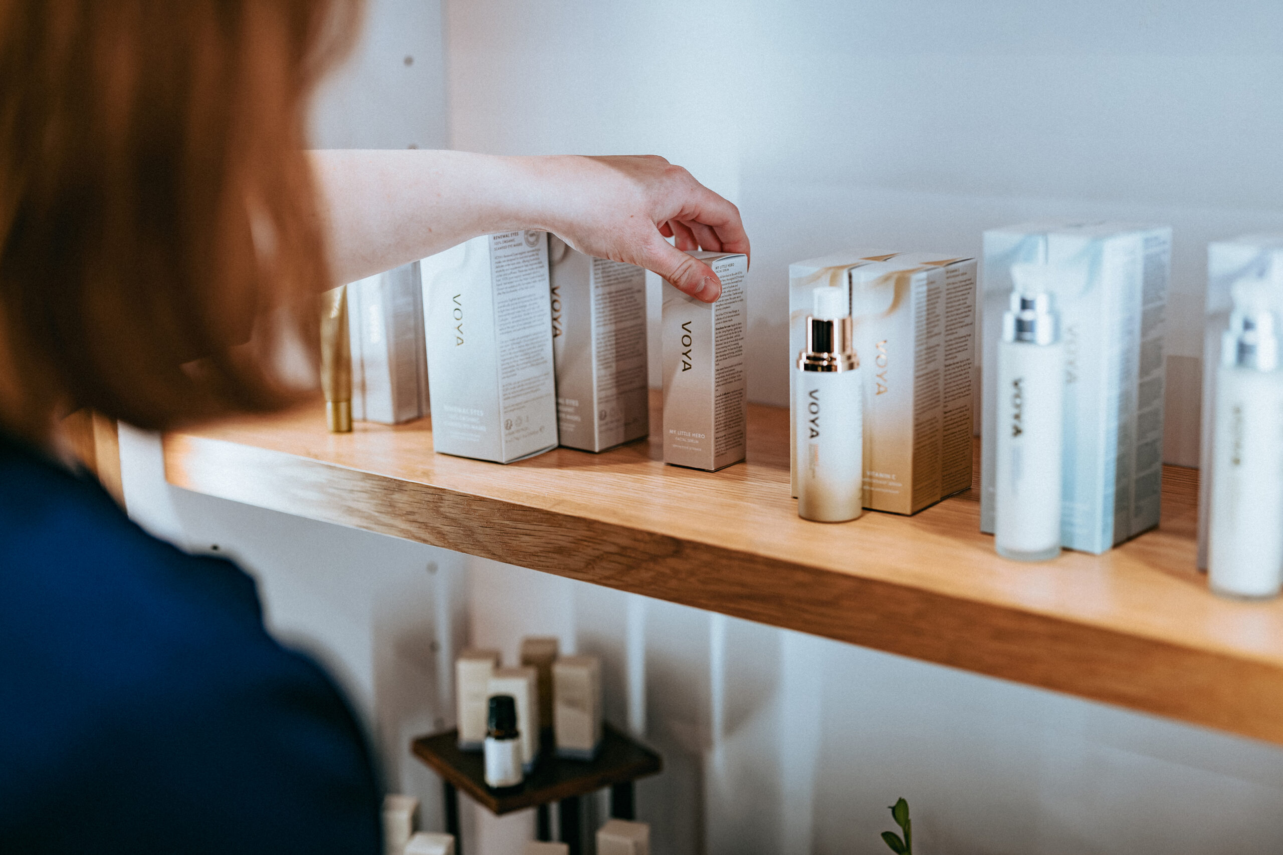 Guest browsing skincare products in The Spa Boutique at The Spa at Skaneateles Fields.